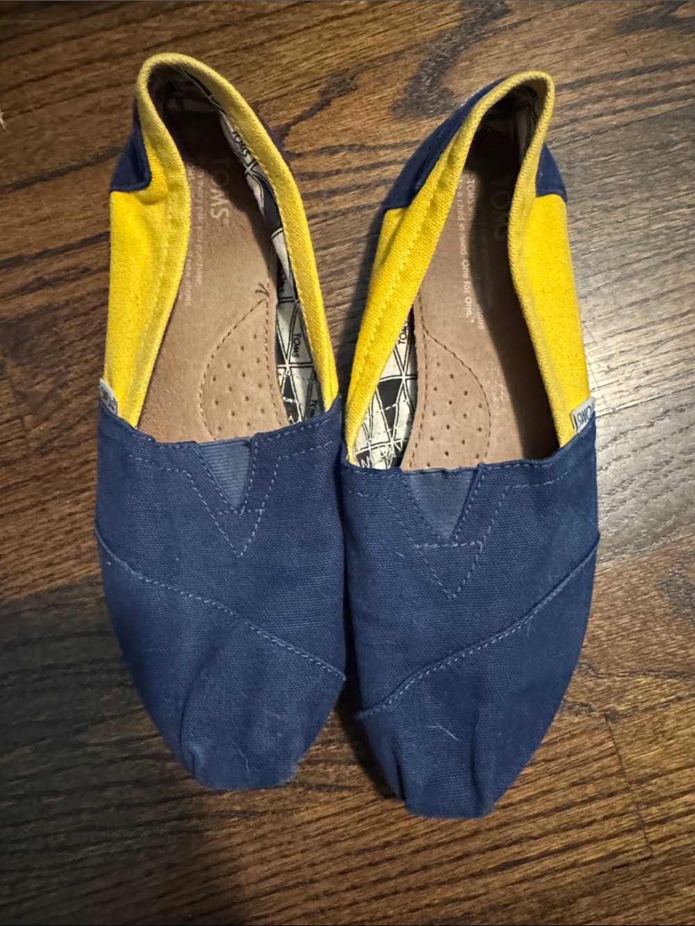 Toms Women's Navy Canvas Slip-On Flats with Yellow Accents